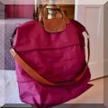 H02. Longchamp expandable travel bag. 